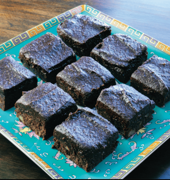 Delicious black sesame rice cakes arranged on a decorative plate.