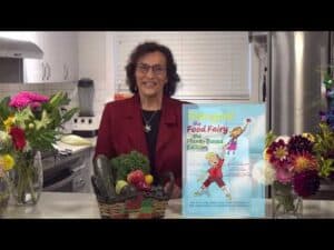 Healthy food fairy with fruits and vegetables in a kitchen setting.