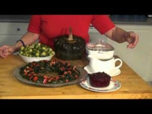 Thanksgiving vegetables and cranberry sauce on table.