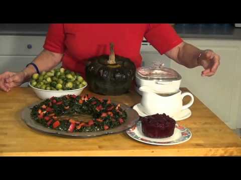 Thanksgiving vegetables and cranberry sauce on table.